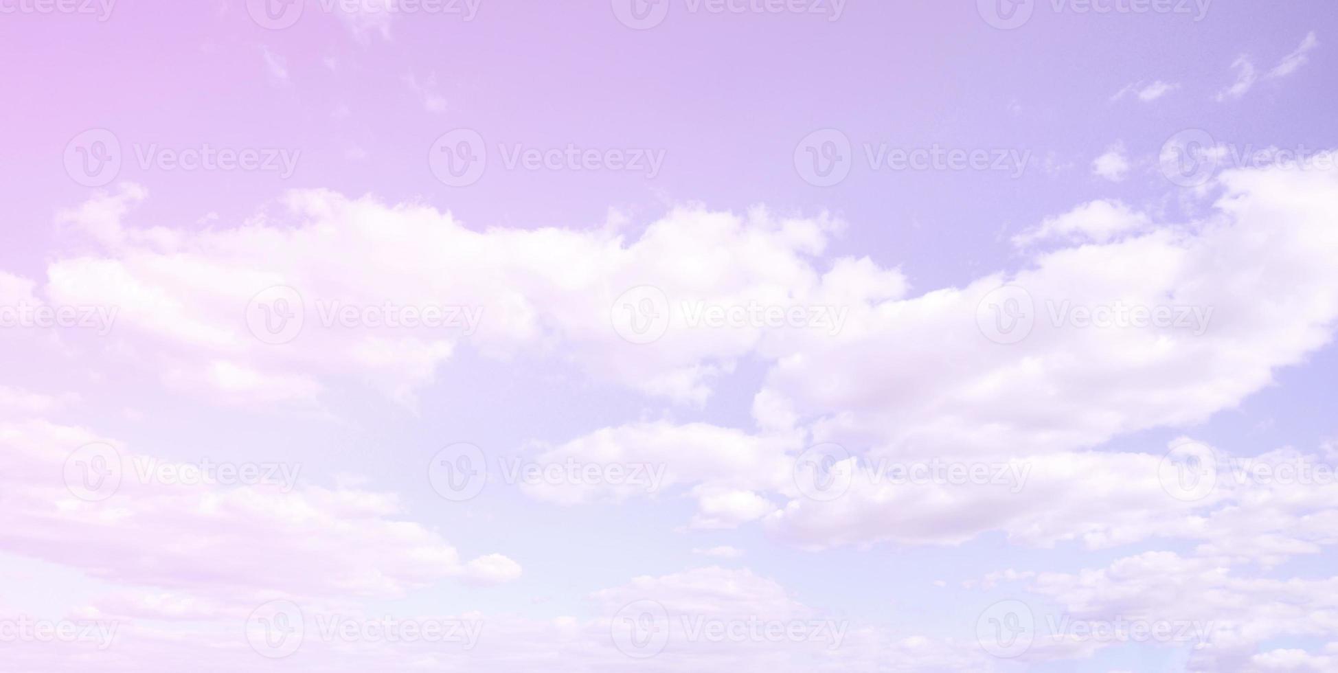 A blue sky with lots of white clouds of different sizes photo