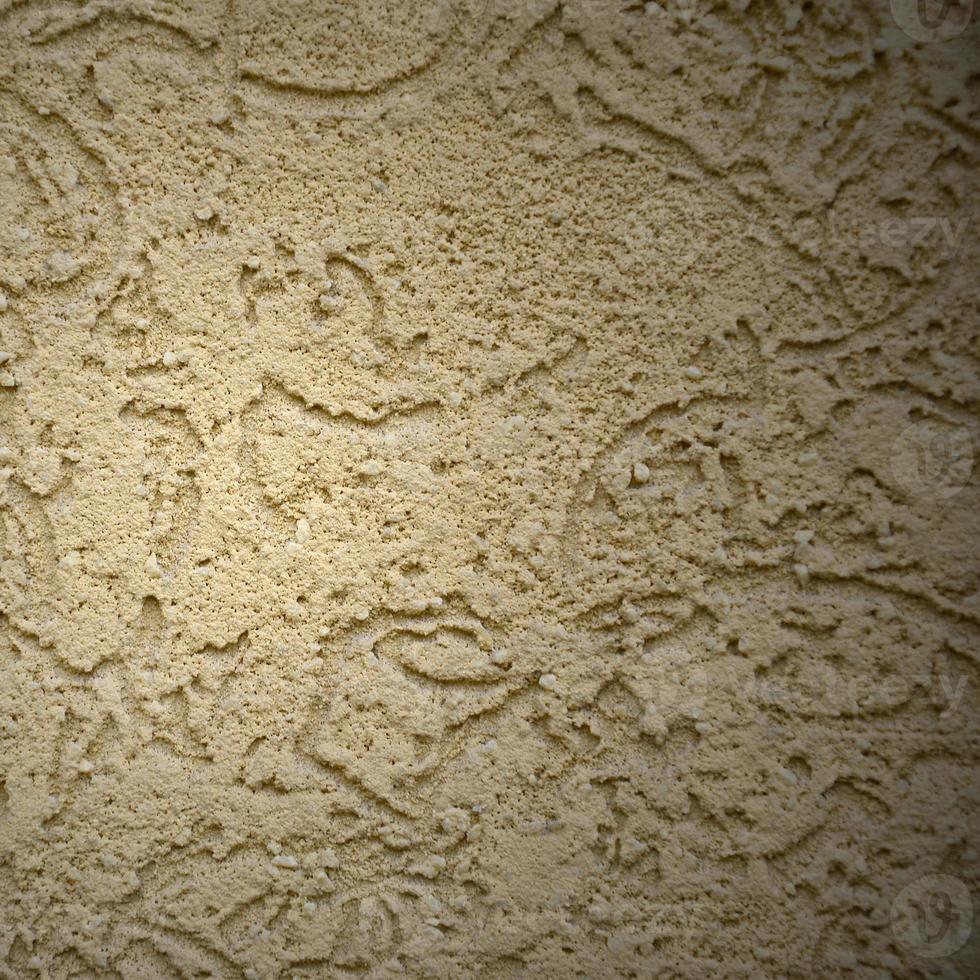 The texture of the beige decorative plaster in bark beetle style photo