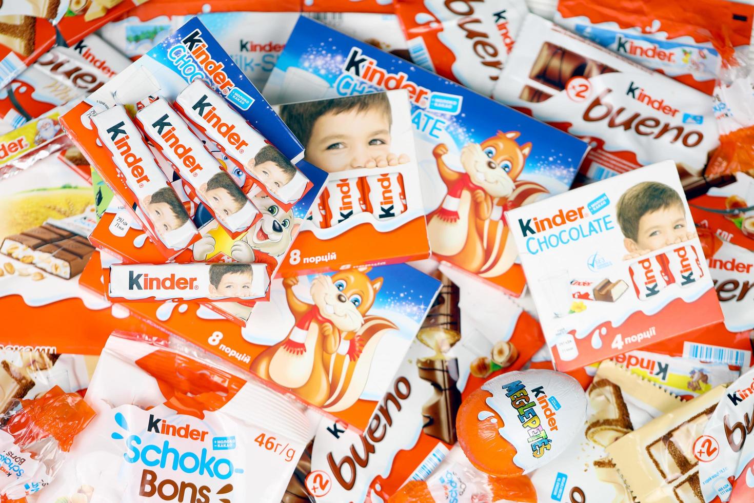 KHARKIV, UKRAINE - FEBRUARY 14, 2022 Kinder Chocolate various production. Kinder is a confectionery product brand line of multinational confectionery Ferrero. photo
