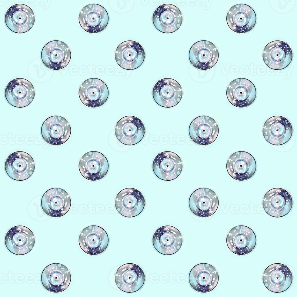 Many used spray cans for graffiti drawing lies on a pastel colored backgroung. Street art painting concept. Minimal flat lay pattern. Top view photo