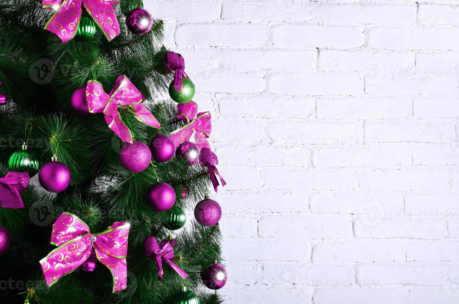 Detailed photo of the Christmas tree on white brick wall