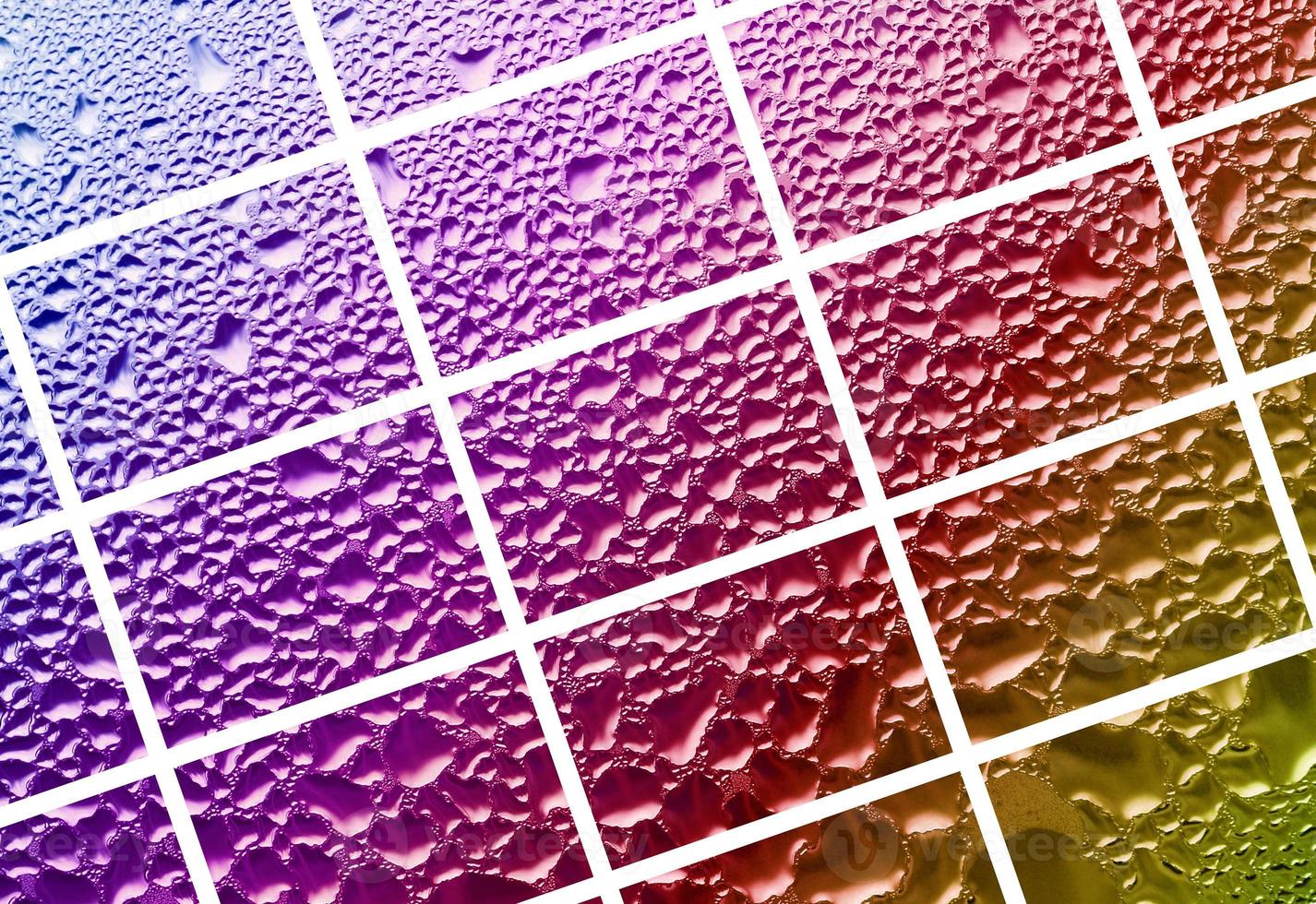 A collage of many different fragments of glass, decorated with rain drops from the condensate. Rainbow colors photo