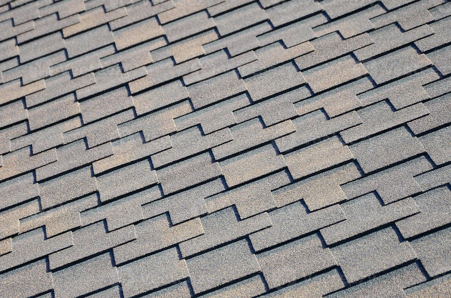 Modern roofing and decoration of chimneys. Flexible bitumen or slate shingles photo