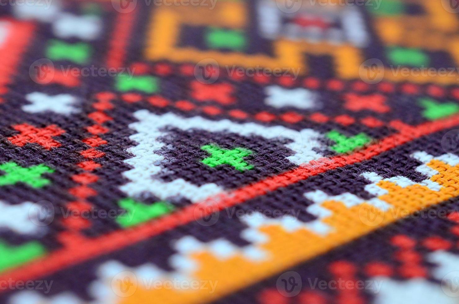 Traditional Ukrainian folk art knitted embroidery pattern on textile fabric photo