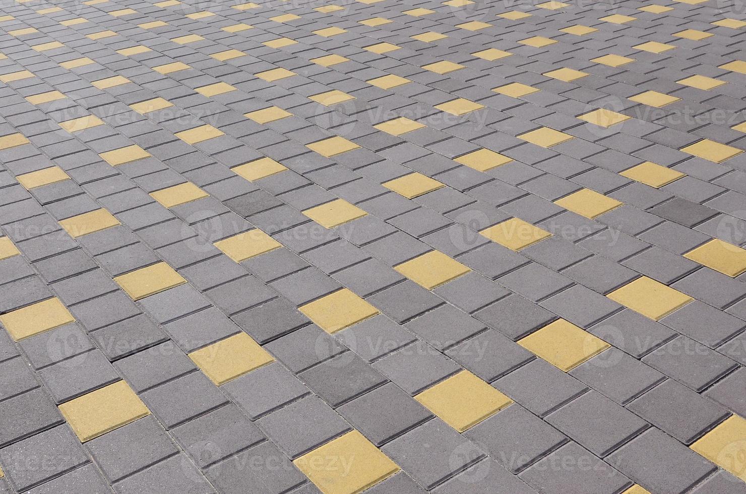 The cobblestones road in town square. Background texture in perspective photo