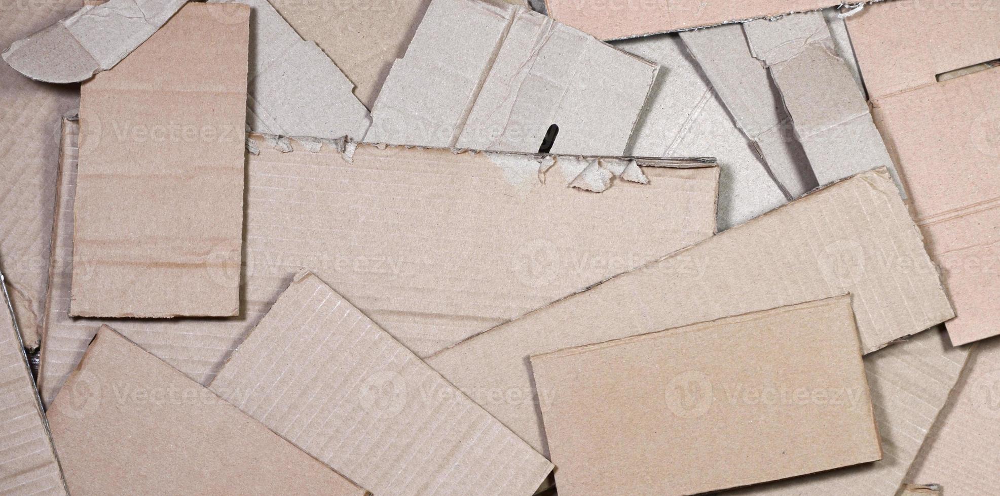 Background of paper textures piled ready to recycle. A pack of old office cardboard for recycling of waste paper. Pile of wastepaper photo