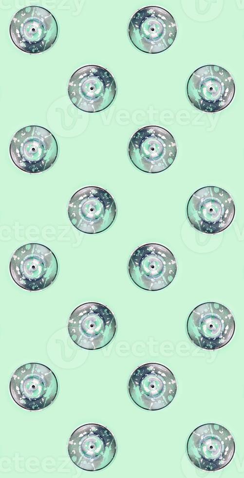Many used spray cans for graffiti drawing lies on a pastel colored backgroung. Street art painting concept. Minimal flat lay pattern. Top view photo