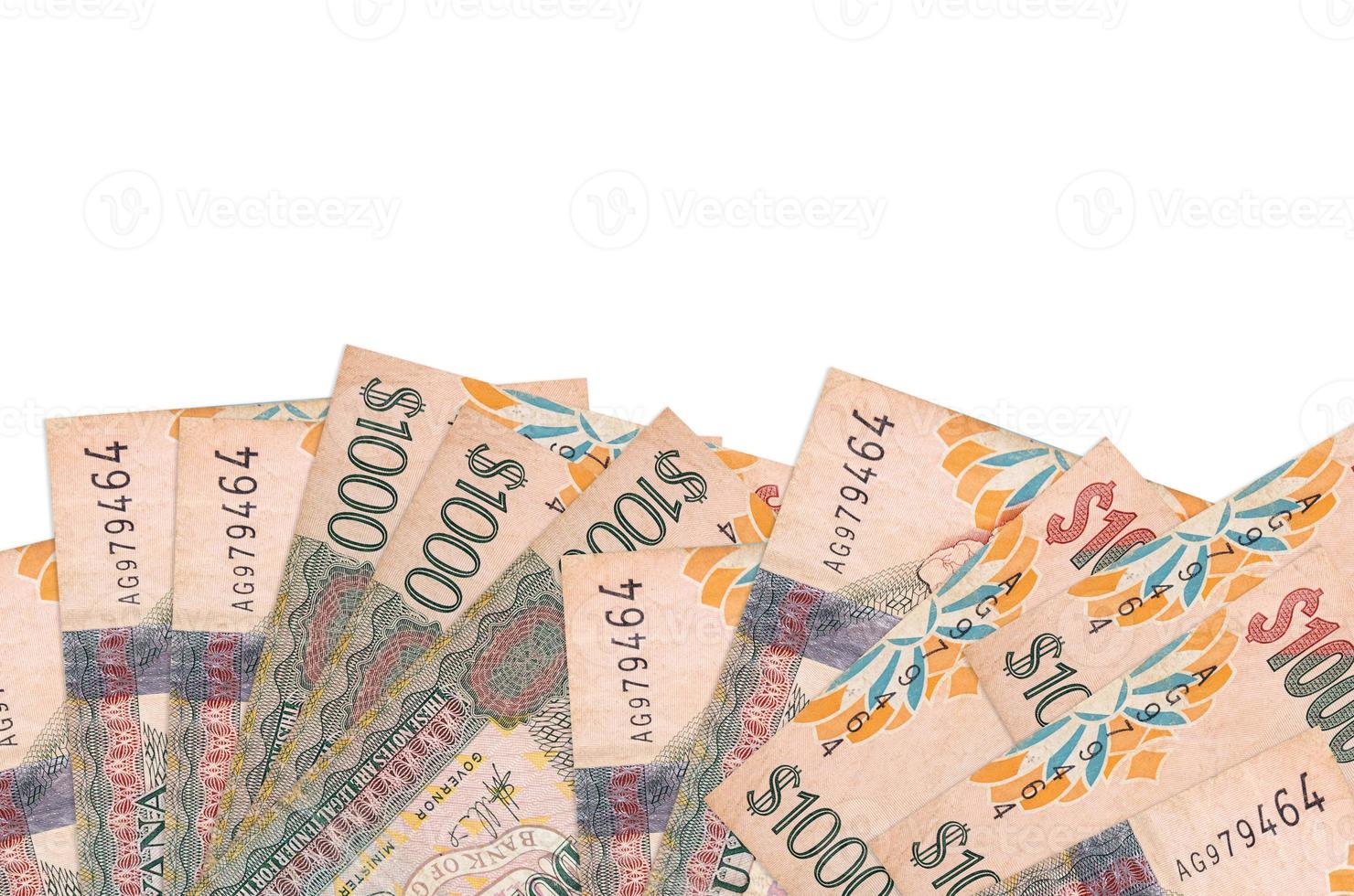 1000 Guyanese dollars bills lies on bottom side of screen isolated on white background with copy space. Background banner template photo