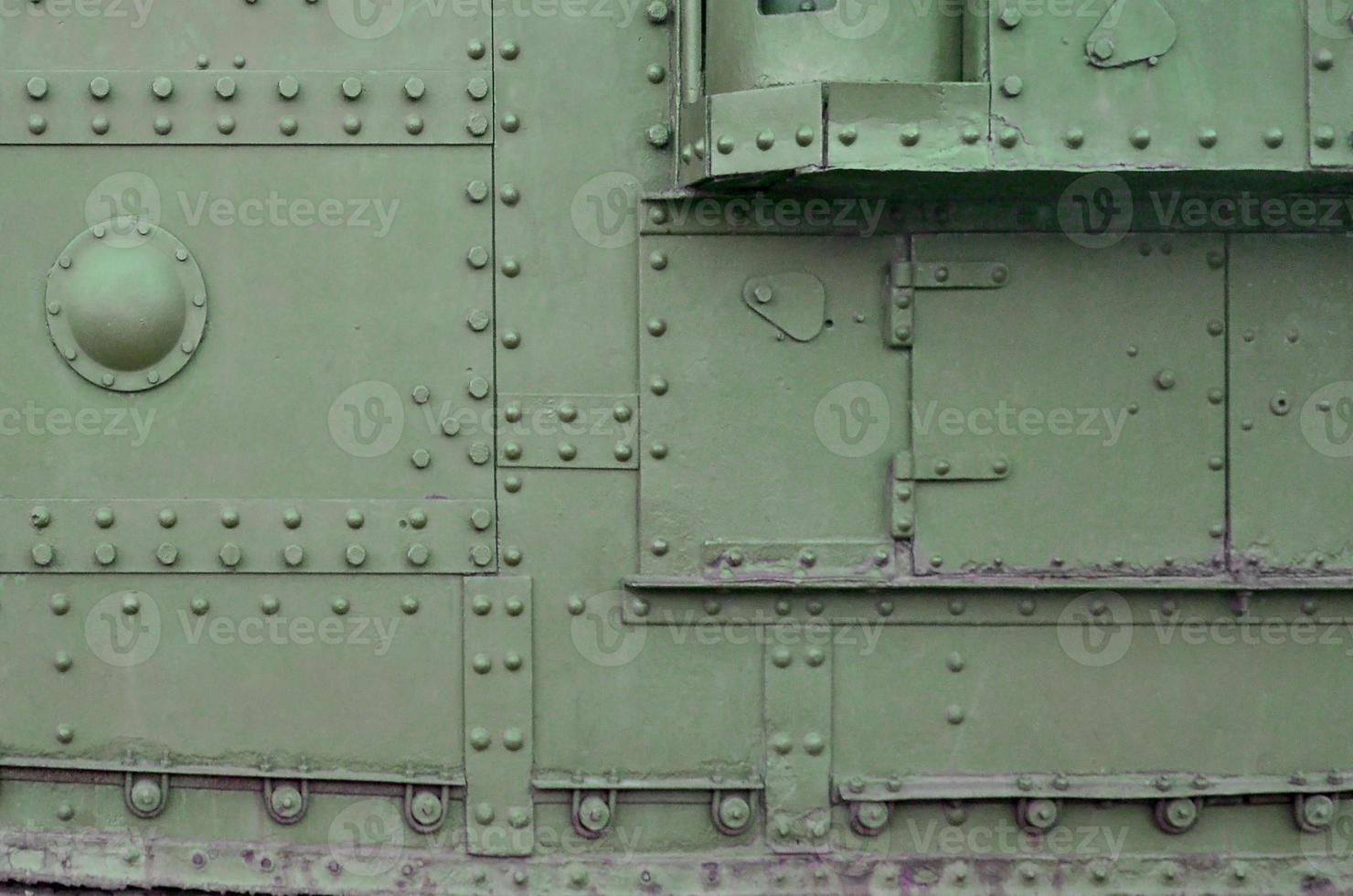 Abstract green industrial metal textured background with rivets and bolts photo