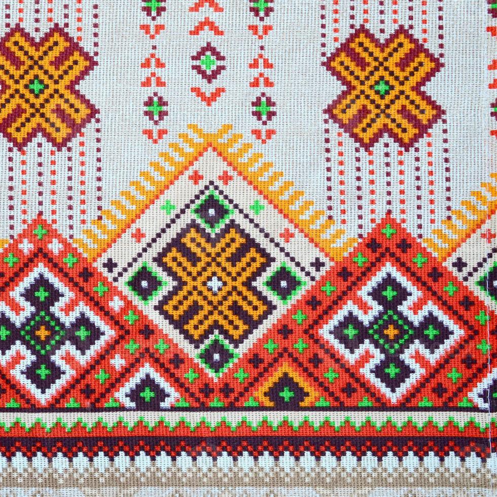 Traditional Ukrainian folk art knitted embroidery pattern on textile fabric photo