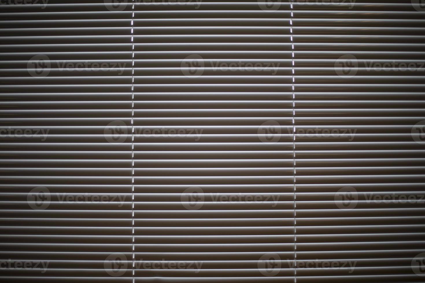 Blinds removed frontally. Window is closed from light. Interior details. photo