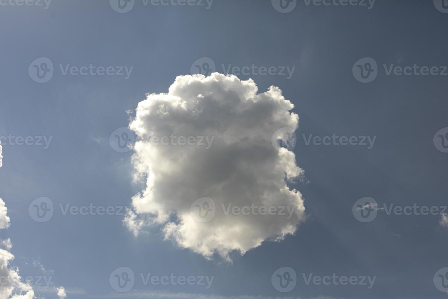 White cloud in blue sky. Atmospheric pressure. Summer sky. photo
