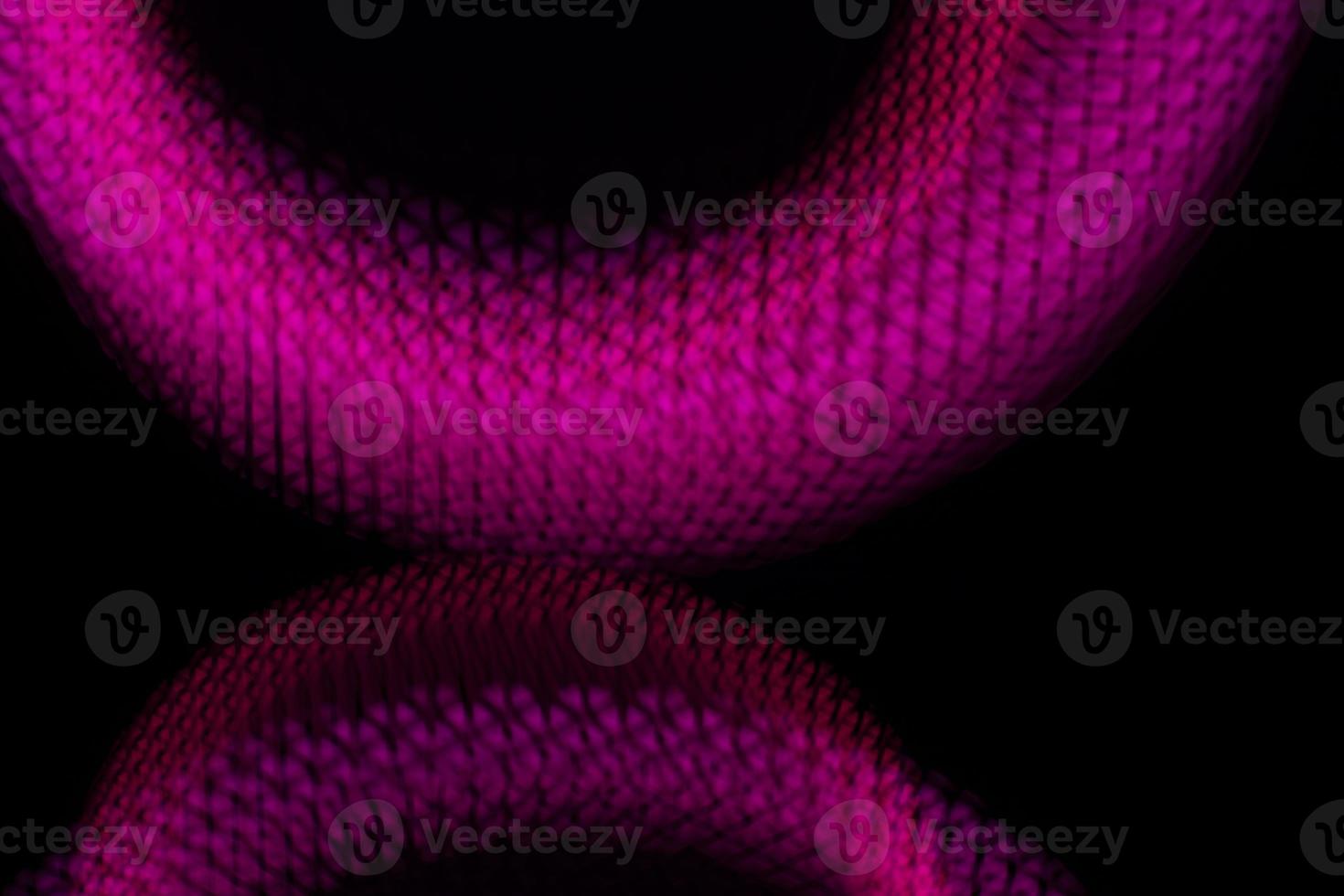 Pink light in dark. Abstract background neon glow. Part of circle in dark. photo