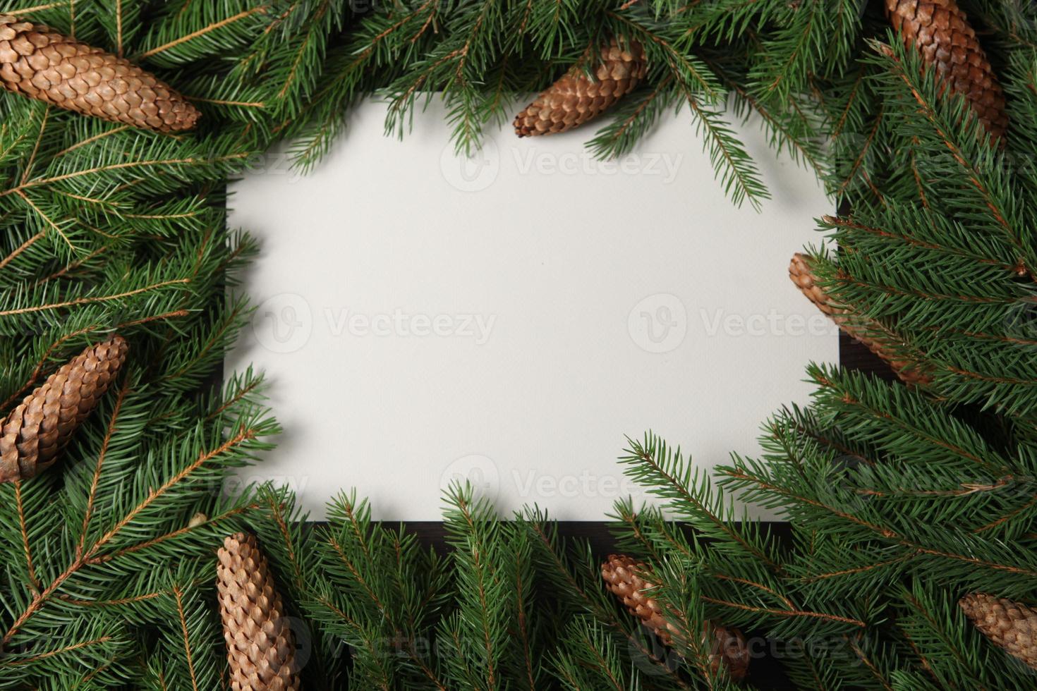 New Year's Eve background with fir branch and cones. Christmas and New Year holidays composition of pine tree branches. Happy New Year 2023 photo