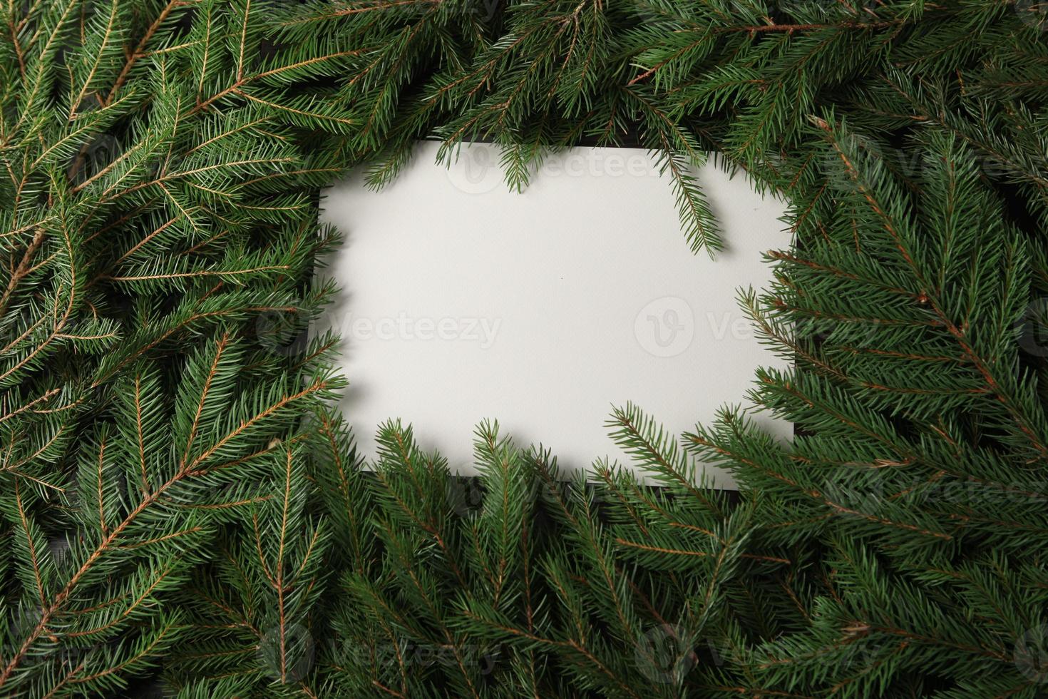 New Year's Eve background with fir branch and cones. Christmas and New Year holidays composition of pine tree branches. Happy New Year 2023 photo