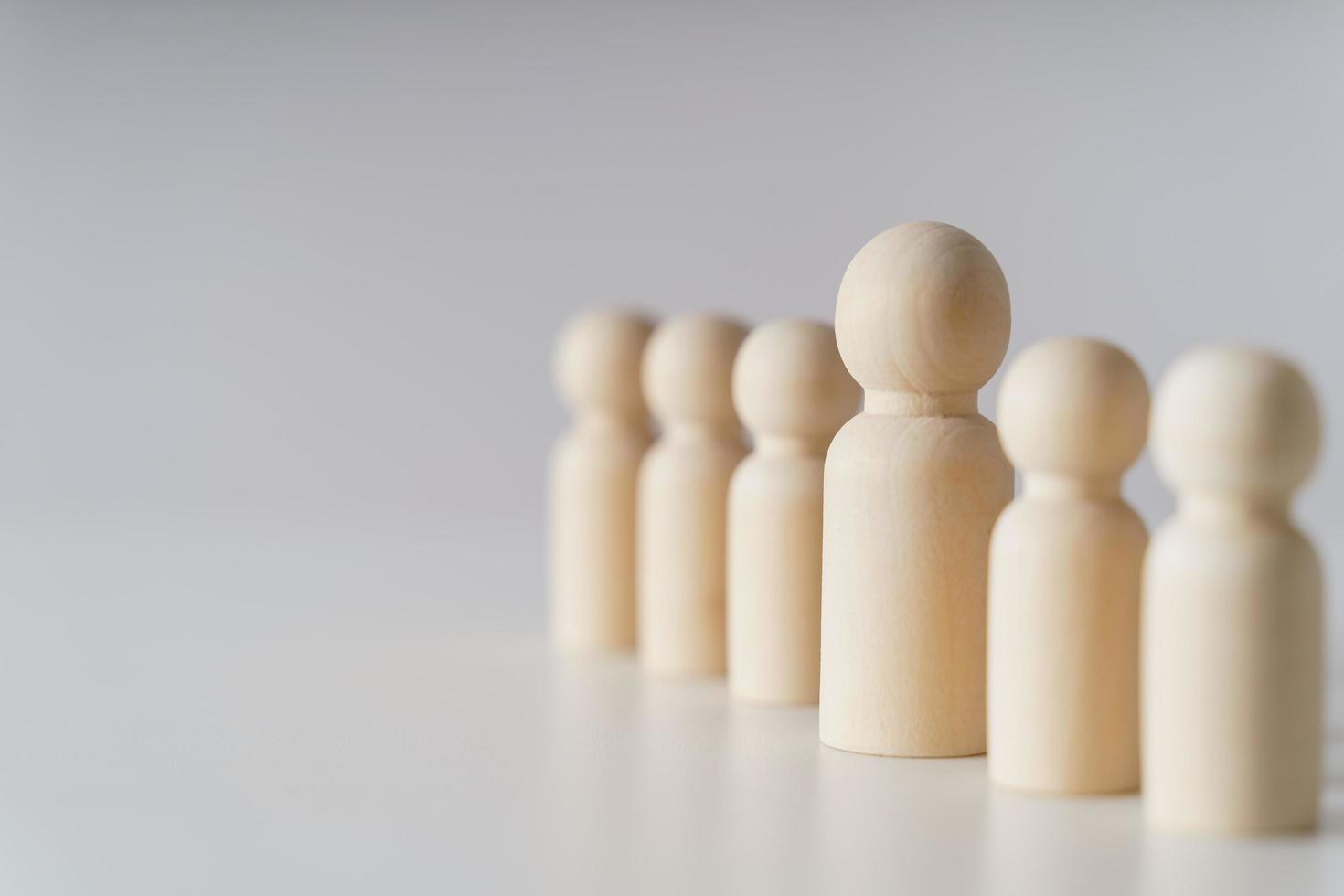 Wooden figures on white background. teamwork, leadership and business team creative thinking and human resources, Recruitment employee concept photo