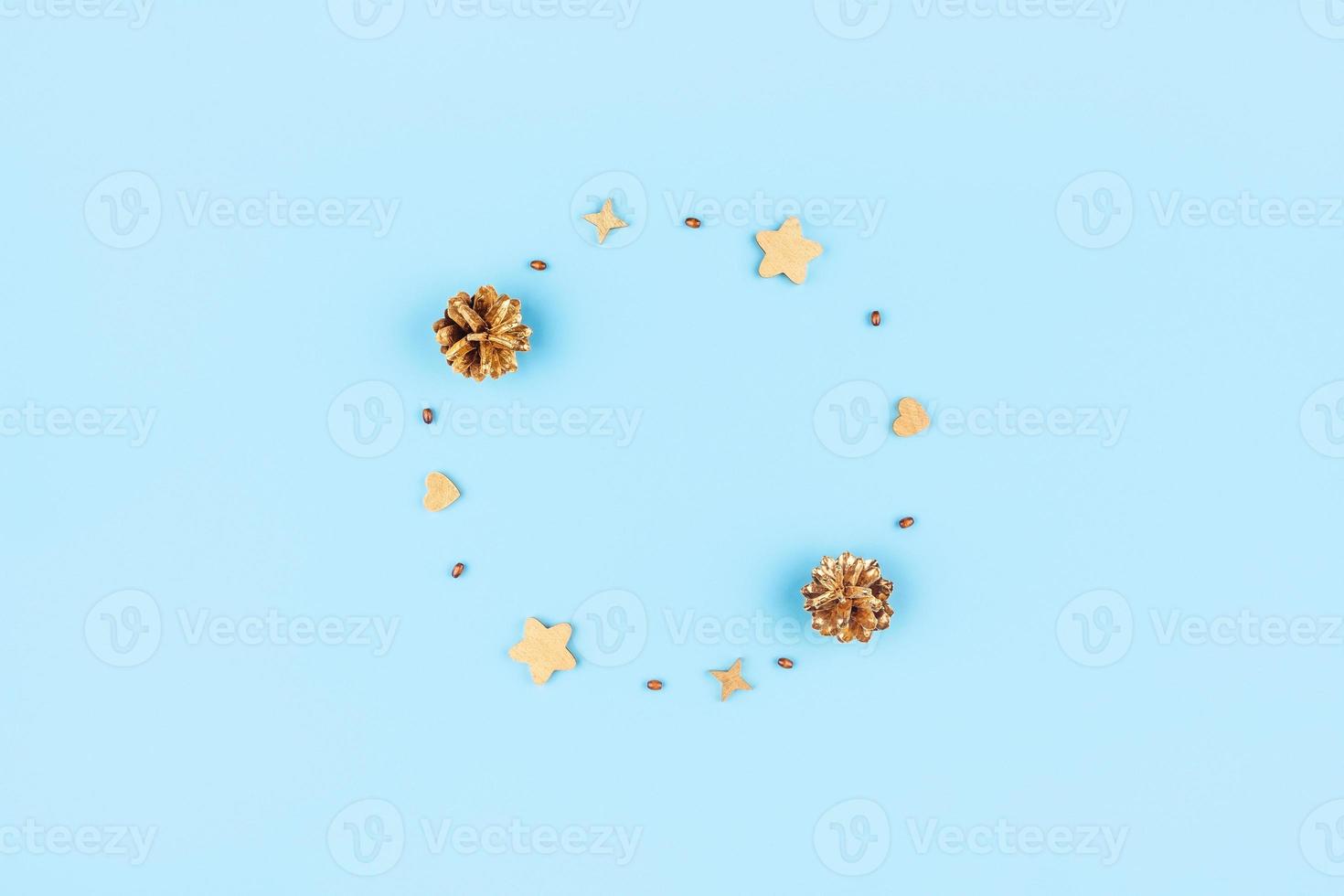 Christmas card with wooden ornaments and pine cones. photo