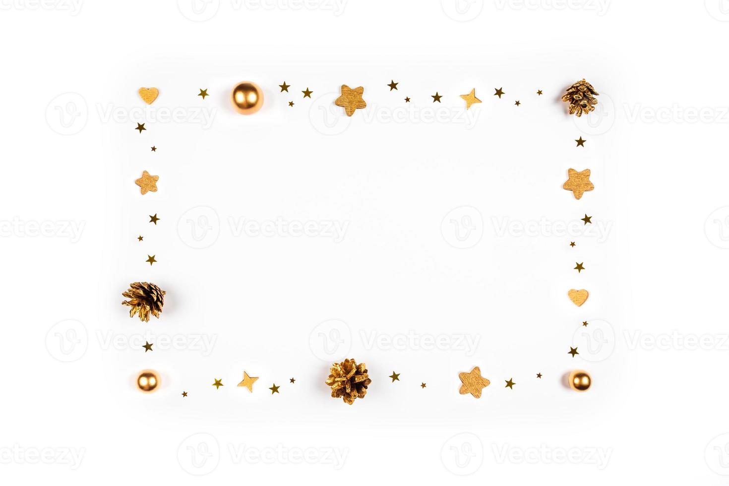 Christmas card. Festive background with pine cones, branches, gold toys. photo
