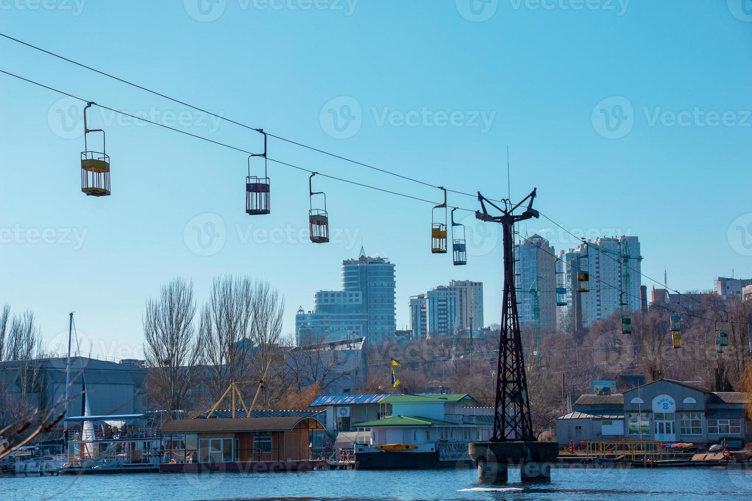 Old cable car in Dnepropetrovsk. Cable car cabins against the background of the blue sky and the urban landscape. photo