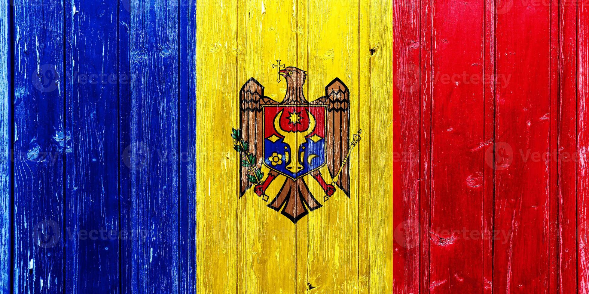 Flag and coat of arms of Moldova on a textured background. Concept collage. photo