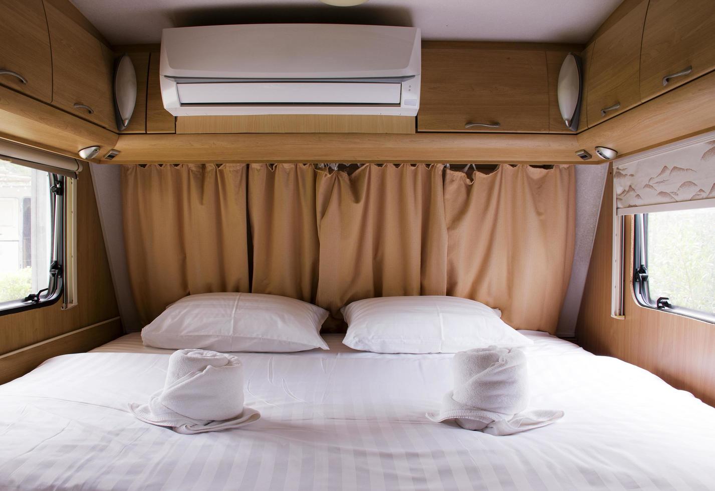 Inside of empty bed in camper van photo