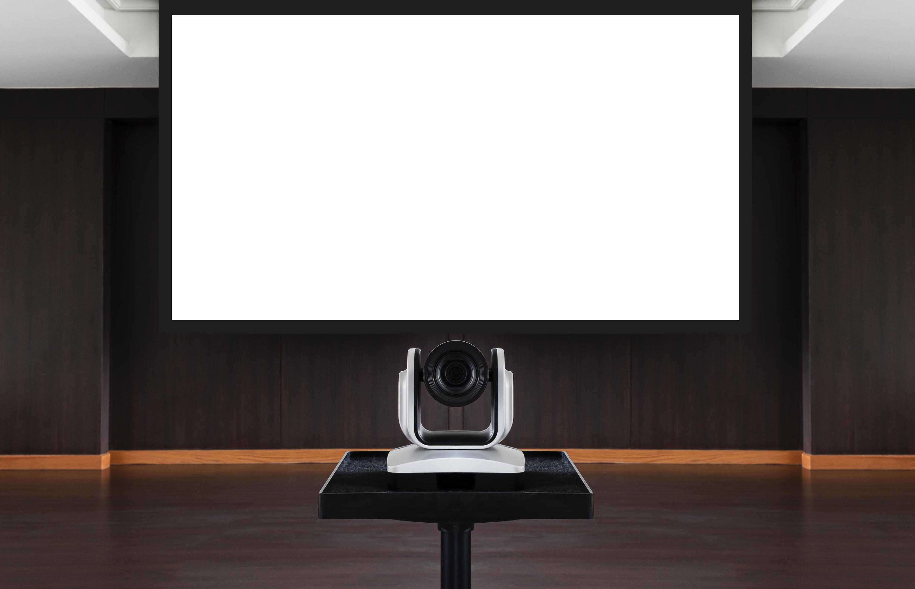 Web camera for online meeting with white projector screen background in