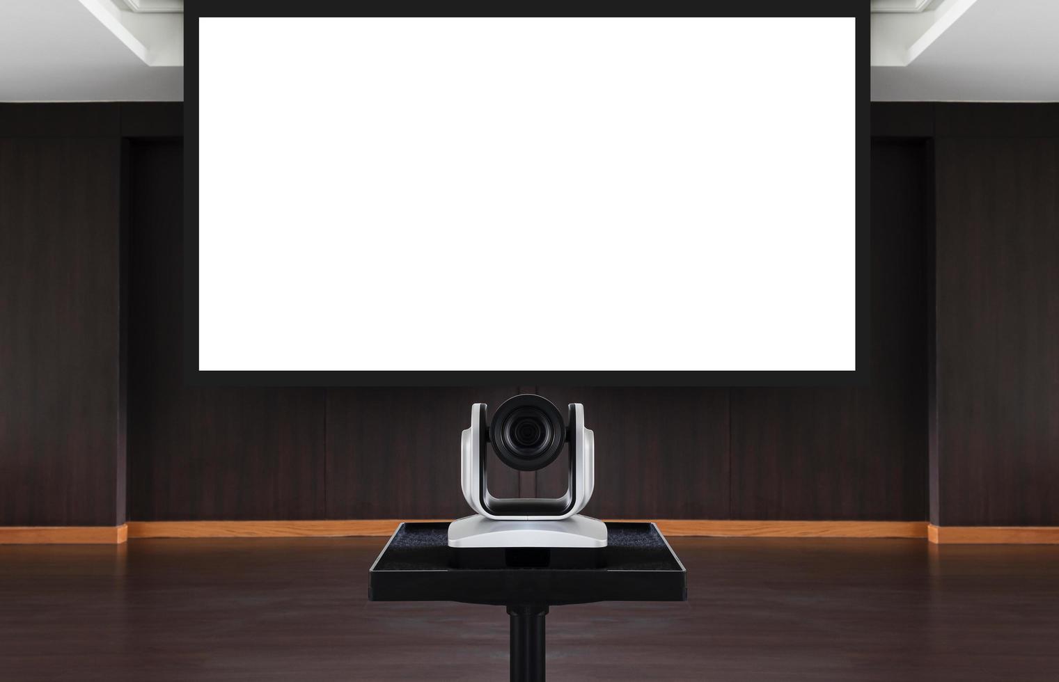 Web camera for online meeting with white projector screen background in meeting room photo