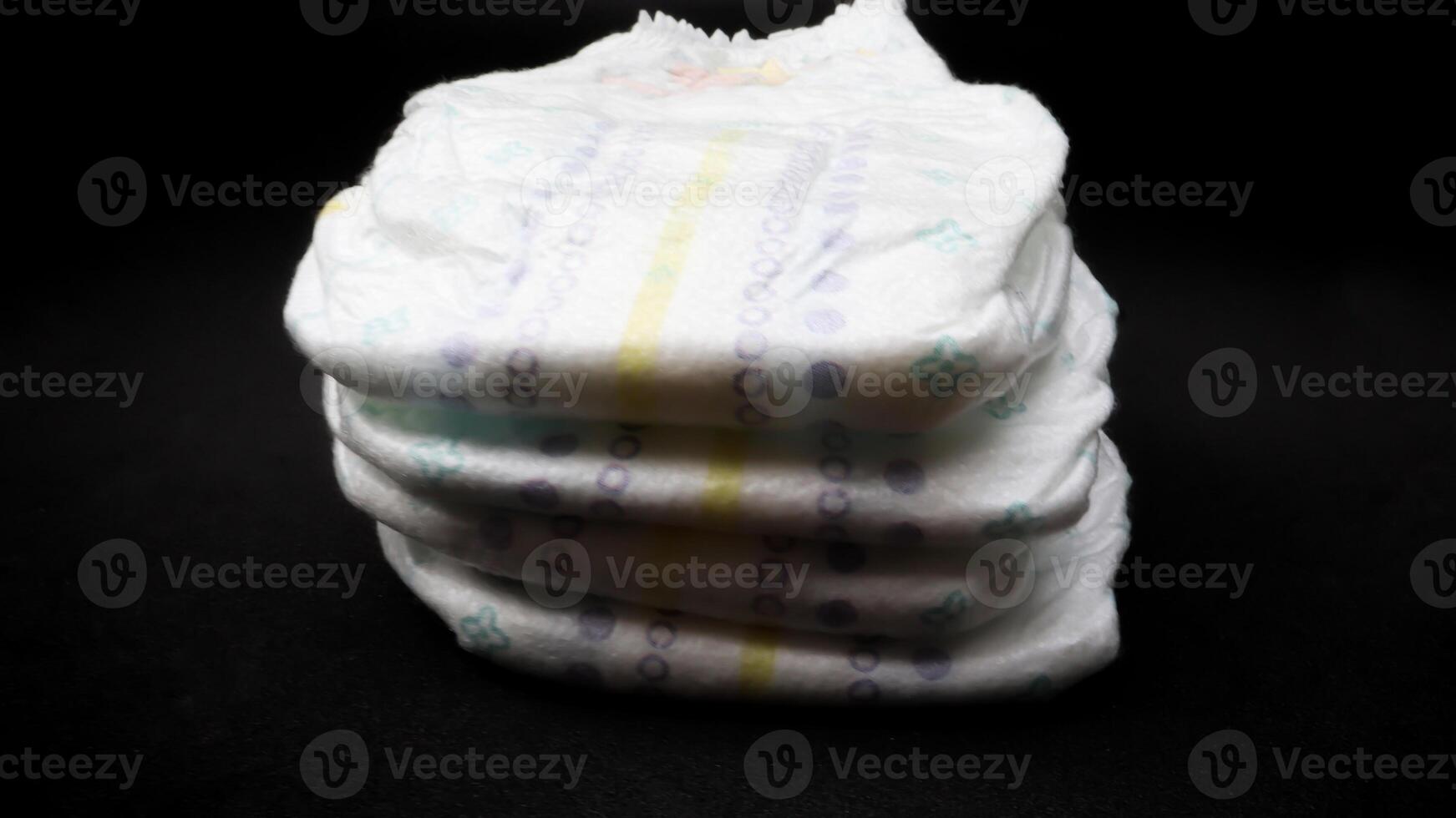 Baby diapers stacked each other on isolated background. 14537626