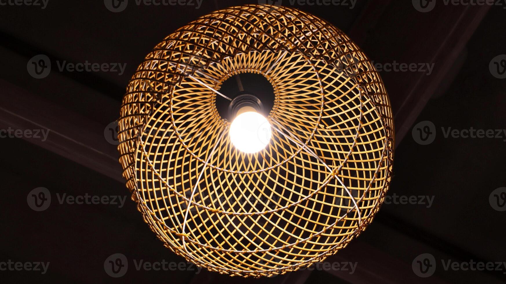 Hanging artistic traditional rattan lamp. photo
