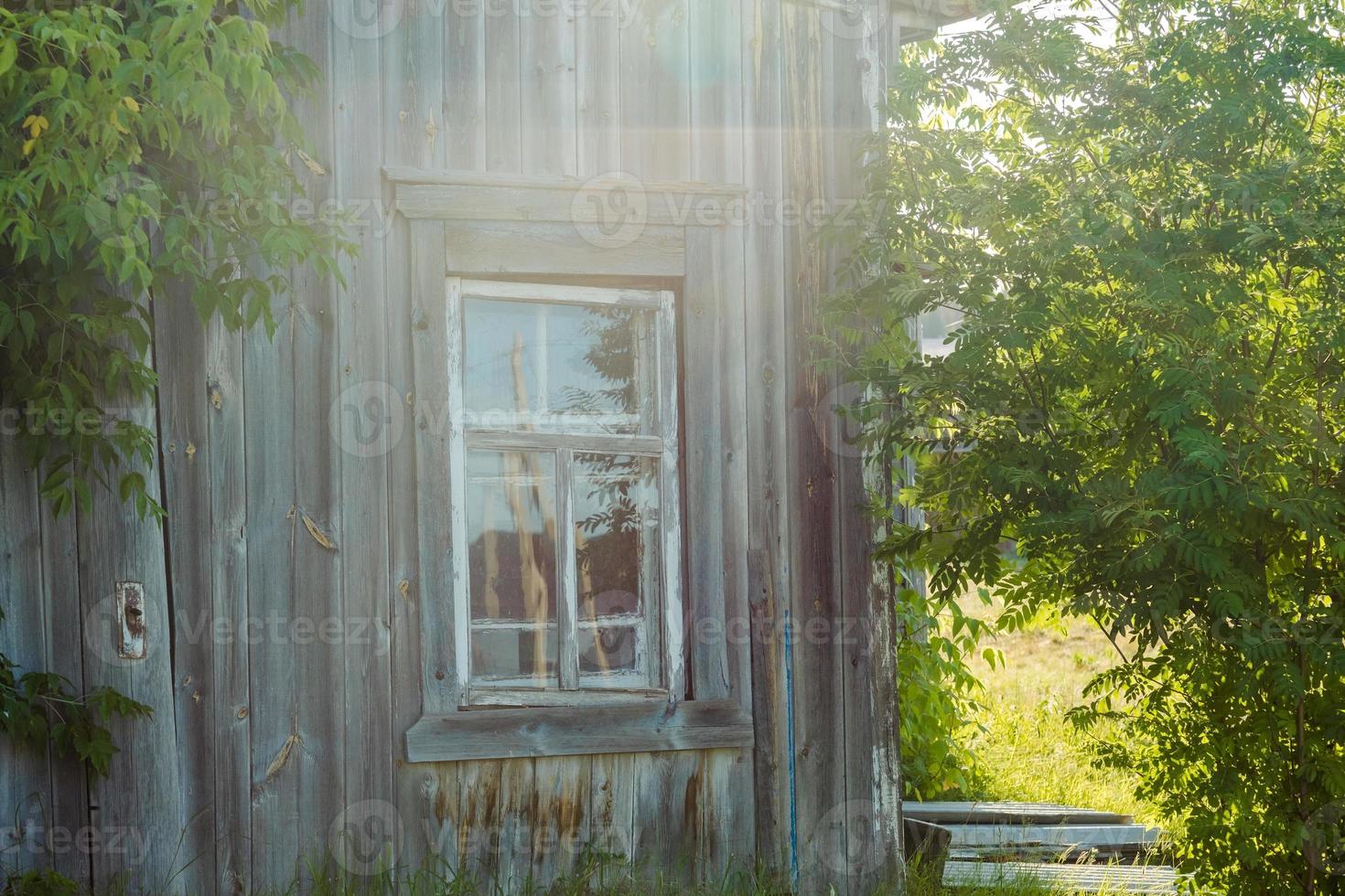 abandoned wooden house with a window, without people photo