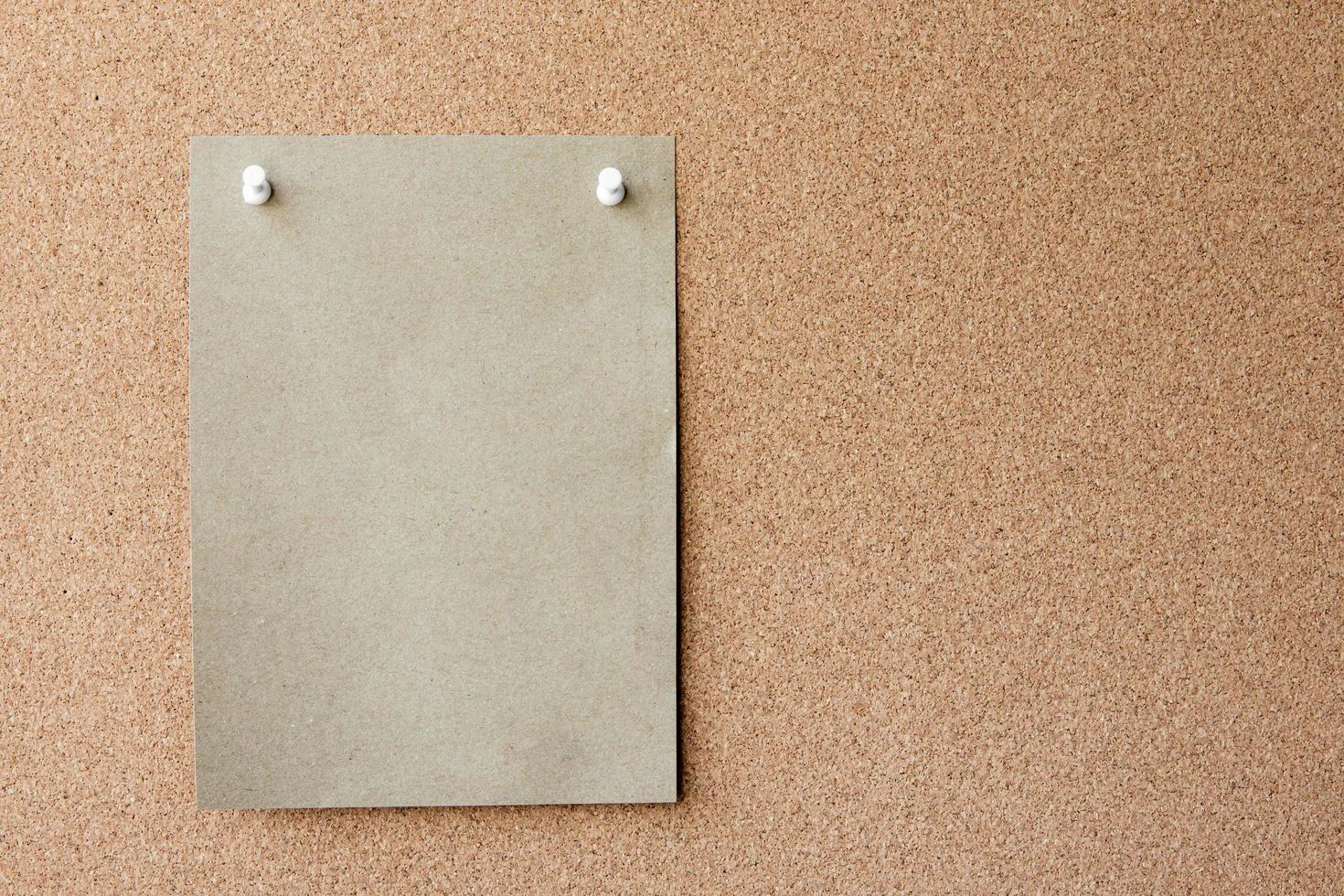 Blank paper note with pin on board. With copy space for ideas, reminders, appointments, to-do lists, messages. photo