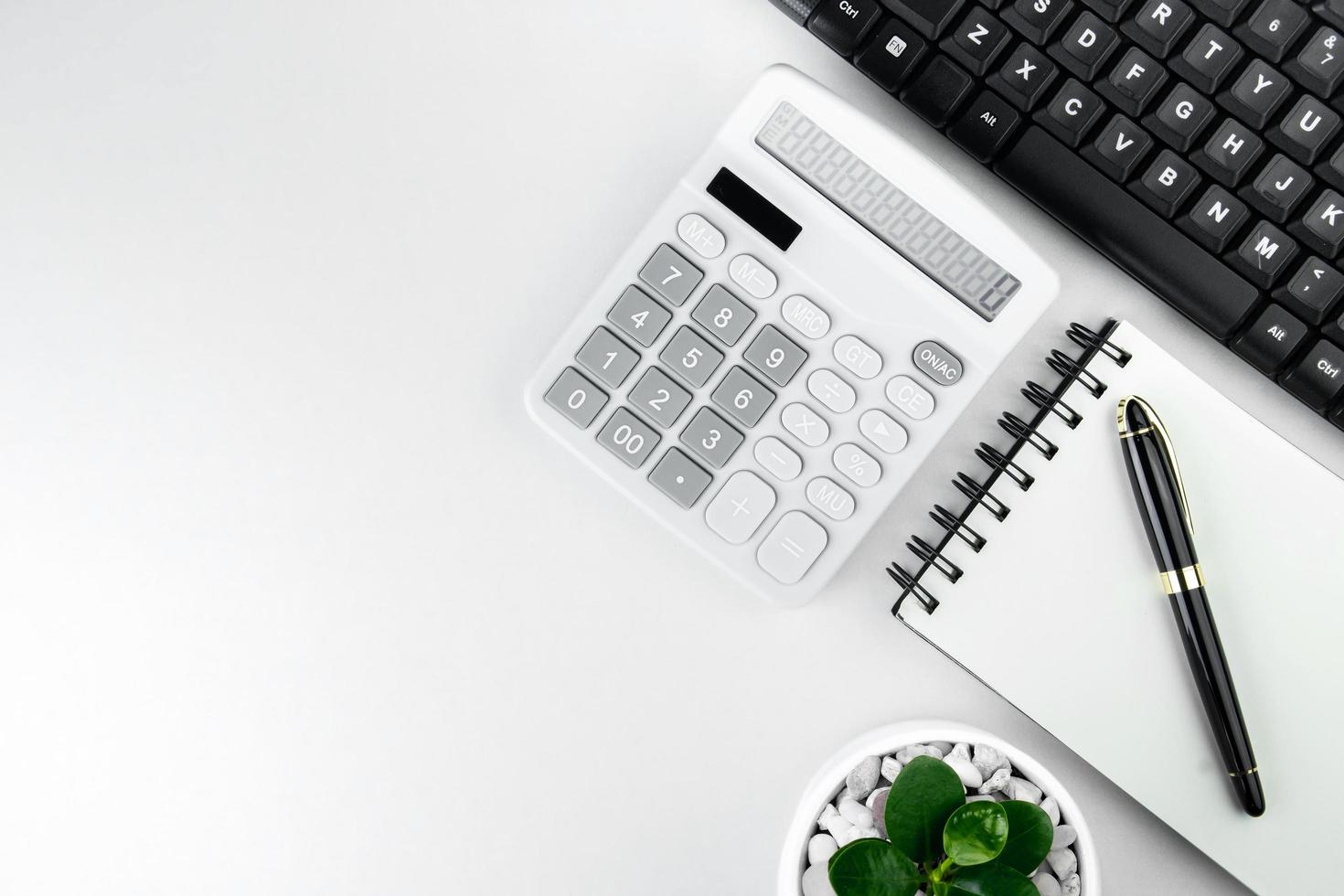 Top view of modern white table. vintage work corner Computer keyboard. call center workspace concept, customer service, online meeting, workspace management style business design area photo