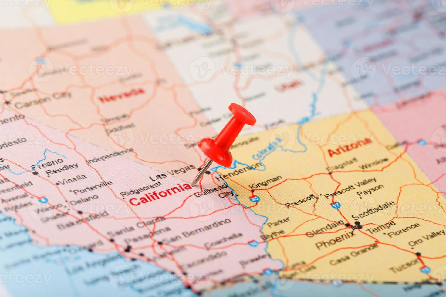 Red clerical needle on a map of USA, California and Sacramento Capital. Close up map of California with red tack photo