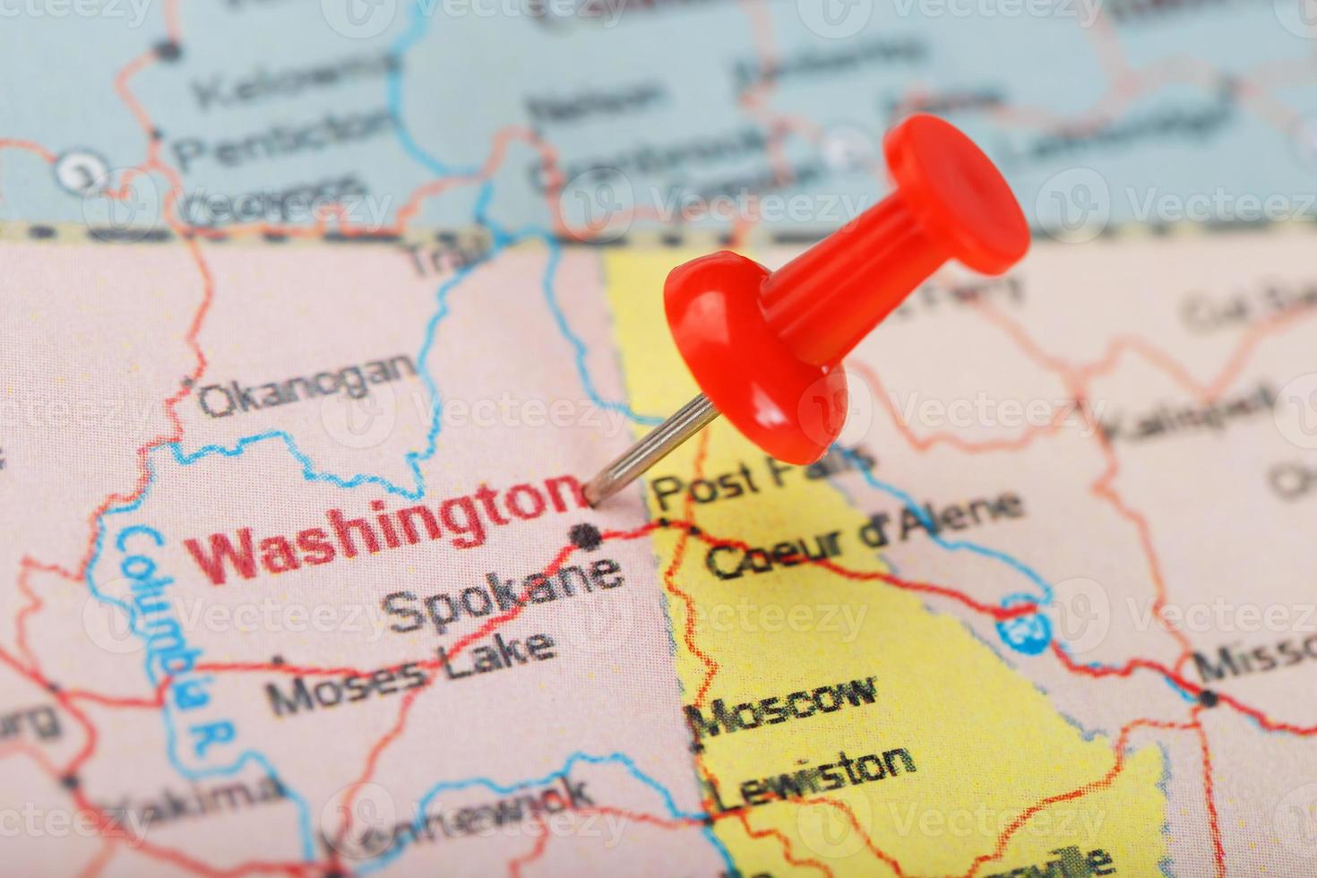 Red clerical needle on map of USA, Washington and DC. Close up map of Washington with red tack photo