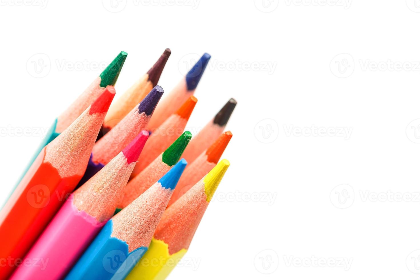 Colored pencils close up on white background, free space for text. photo