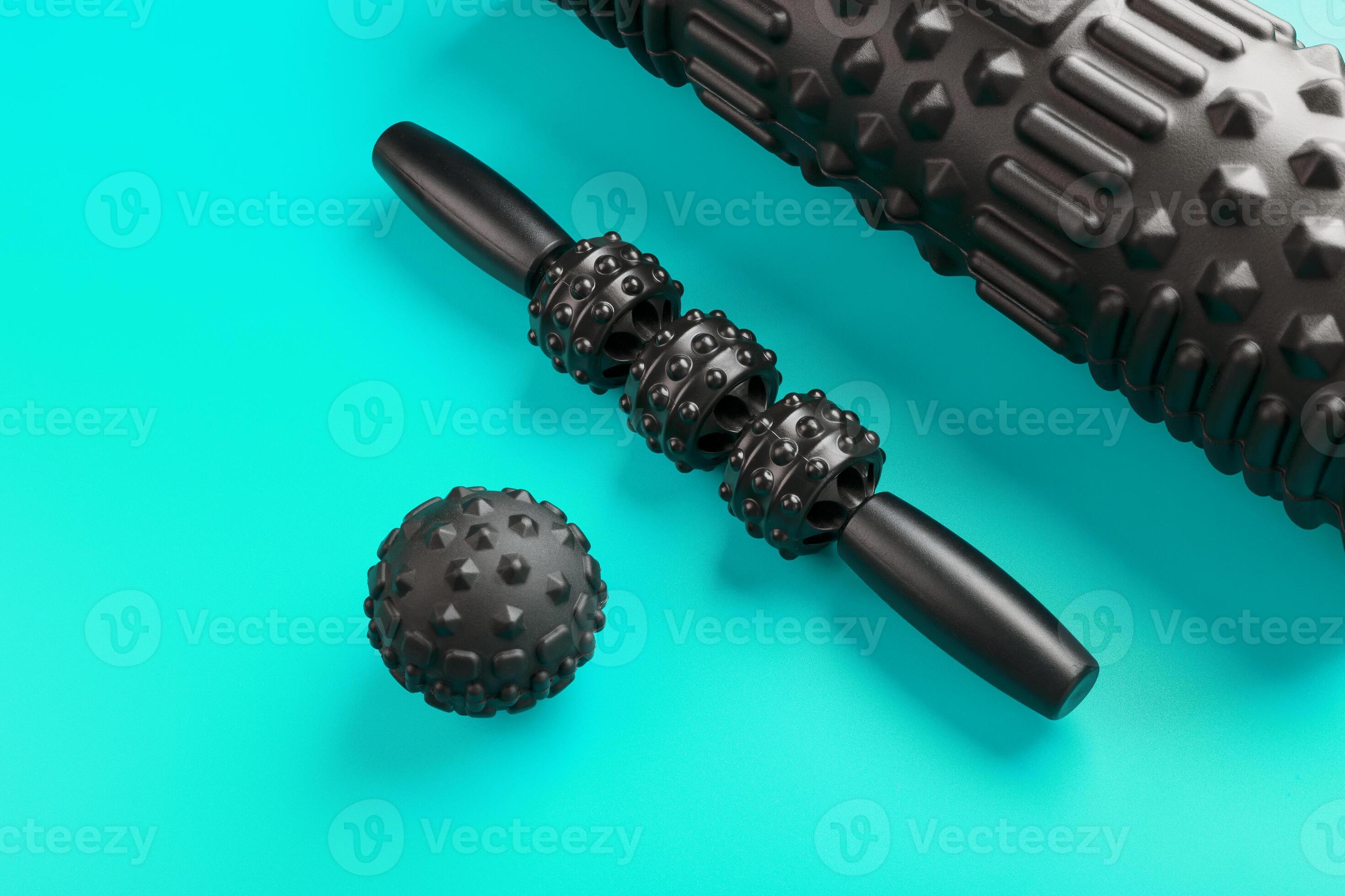 A set of black bumpy foam massage rollers, body rollers, rubber balls