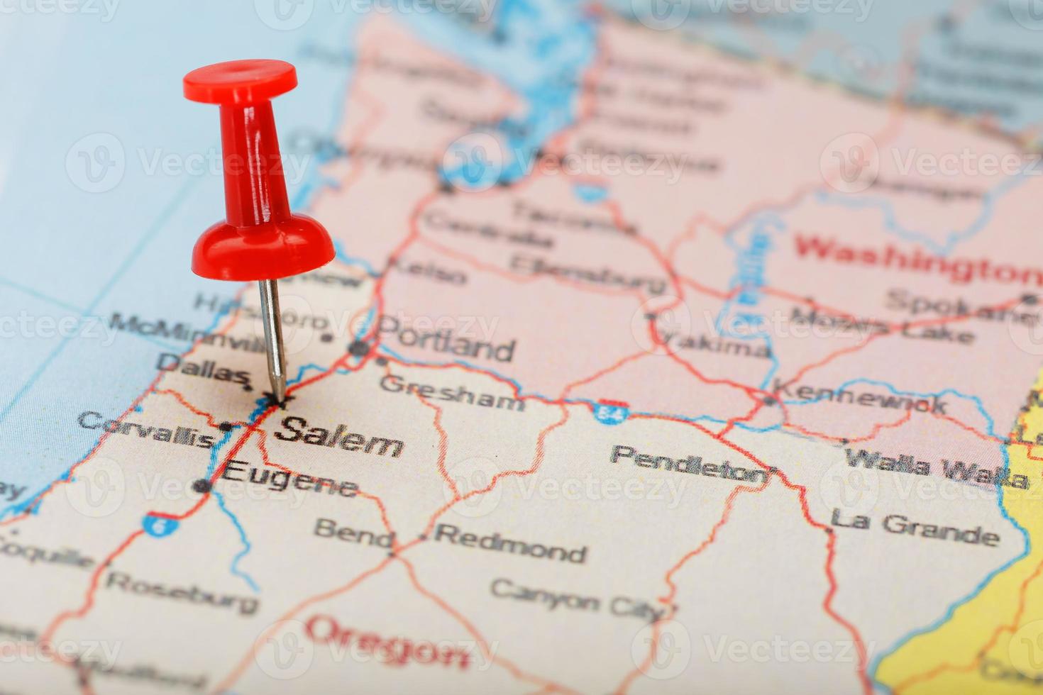 Red clerical needle on a map of USA, Oregon and the capital Salem. Closeup Map Oregon with Red Tack photo