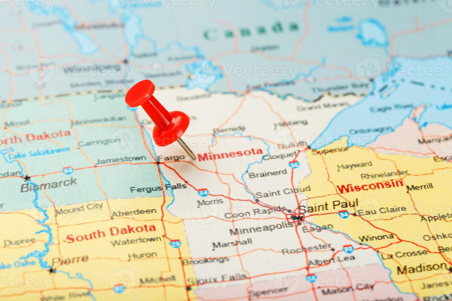 Red clerical needle on a map of USA, Minnesota and the capital Saint Paul. Close up map of Minnesota with red tack photo