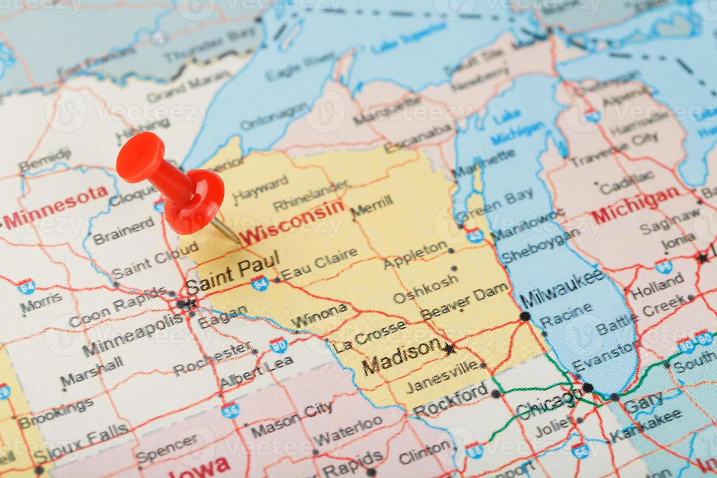 Red clerical needle on a map of USA, Wisconsin and the capital Madison. Close up map of Wisconsin with red tack photo