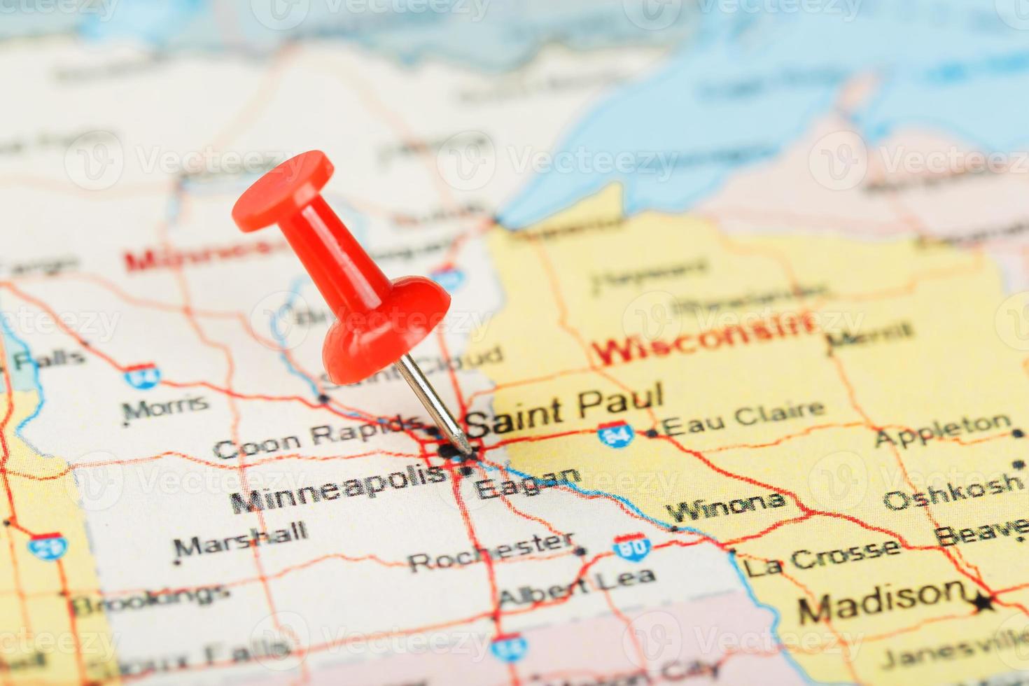 Red clerical needle on a map of USA, Minnesota and the capital Saint Paul. Close up map of Minnesota with red tack photo