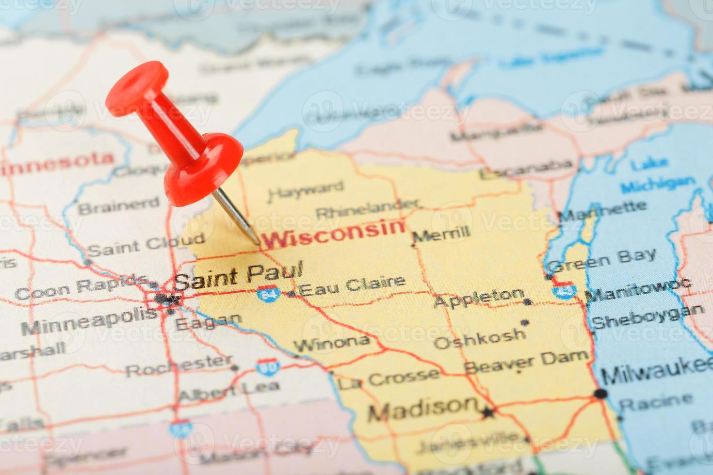 Red clerical needle on a map of USA, Wisconsin and the capital Madison. Close up map of Wisconsin with red tack photo