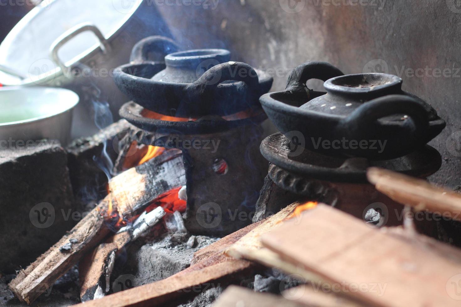 a furnace for making pancakes, made of clay and has a unique and small shape photo