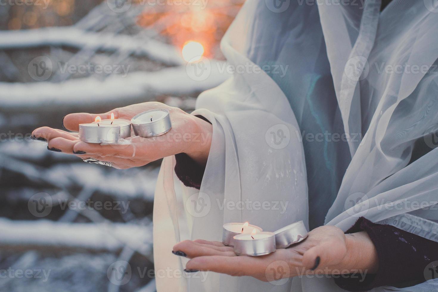 Close up hands with candles concept photo