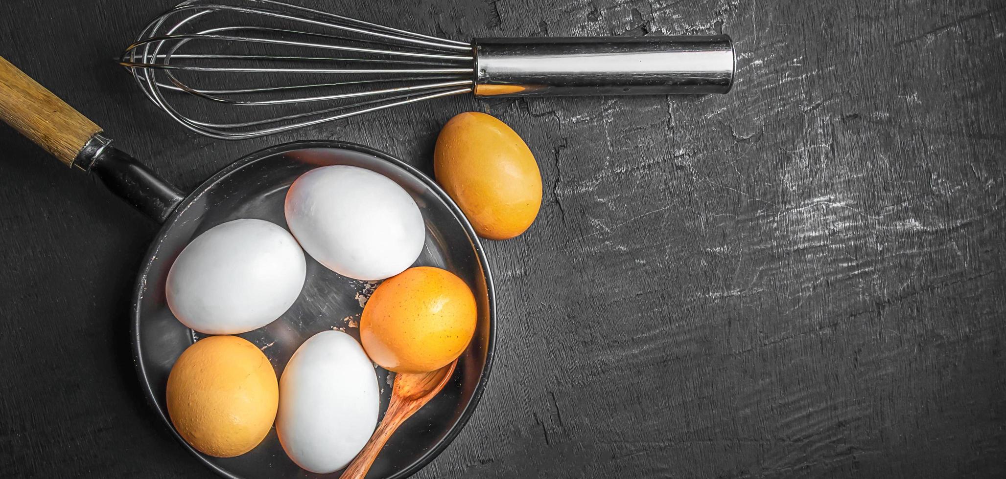 Top view Fresh Egg and duck eggs in a pan. cooking and kitchen ideas photo