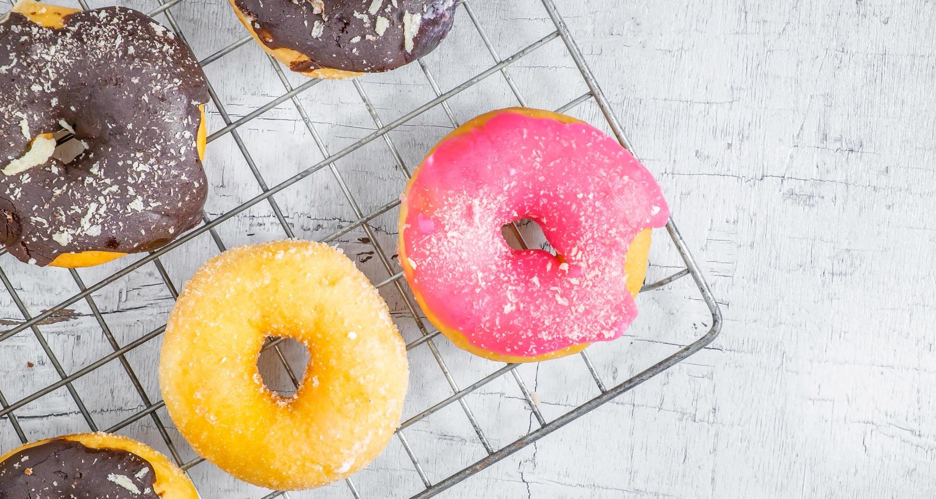 Donuts on a white wood background photo