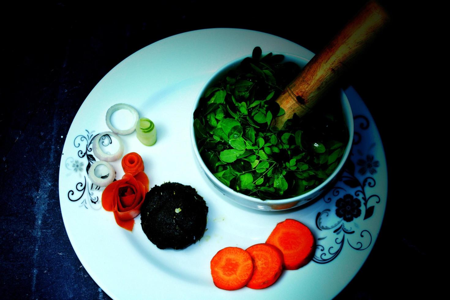 Bangali traditional food Sajne leaf filling. Location - Bogura, Bangladesh. Date - 18 November 2022. photo