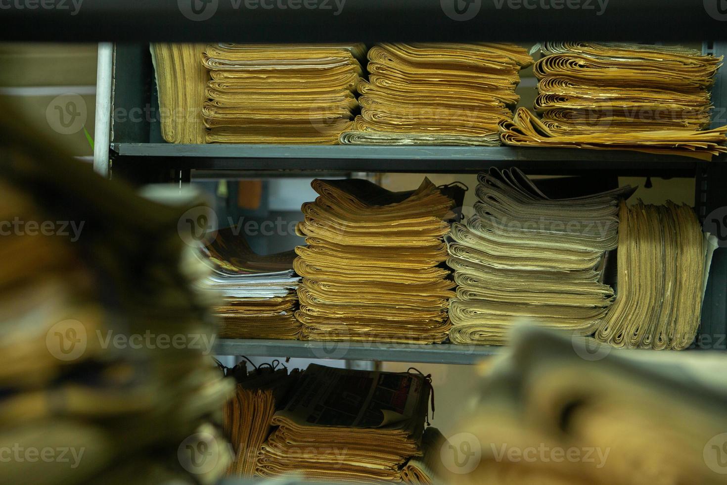 Very old books sitting on the shelves in the library. Books as a symbol of knowledge. photo