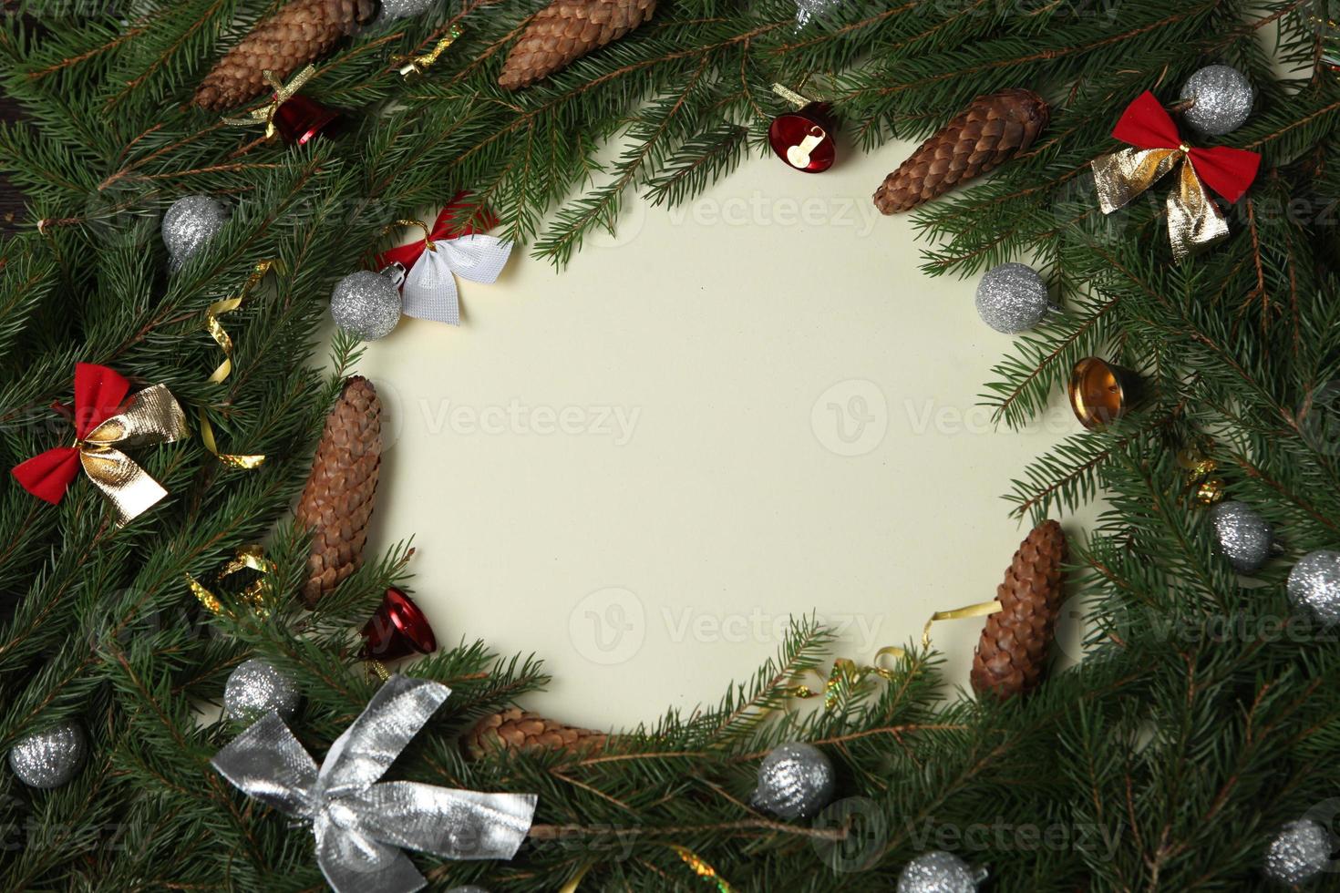 New Year's Eve background with fir branch and cones. Christmas and New Year holidays composition of pine tree branches. Happy New Year 2023 photo