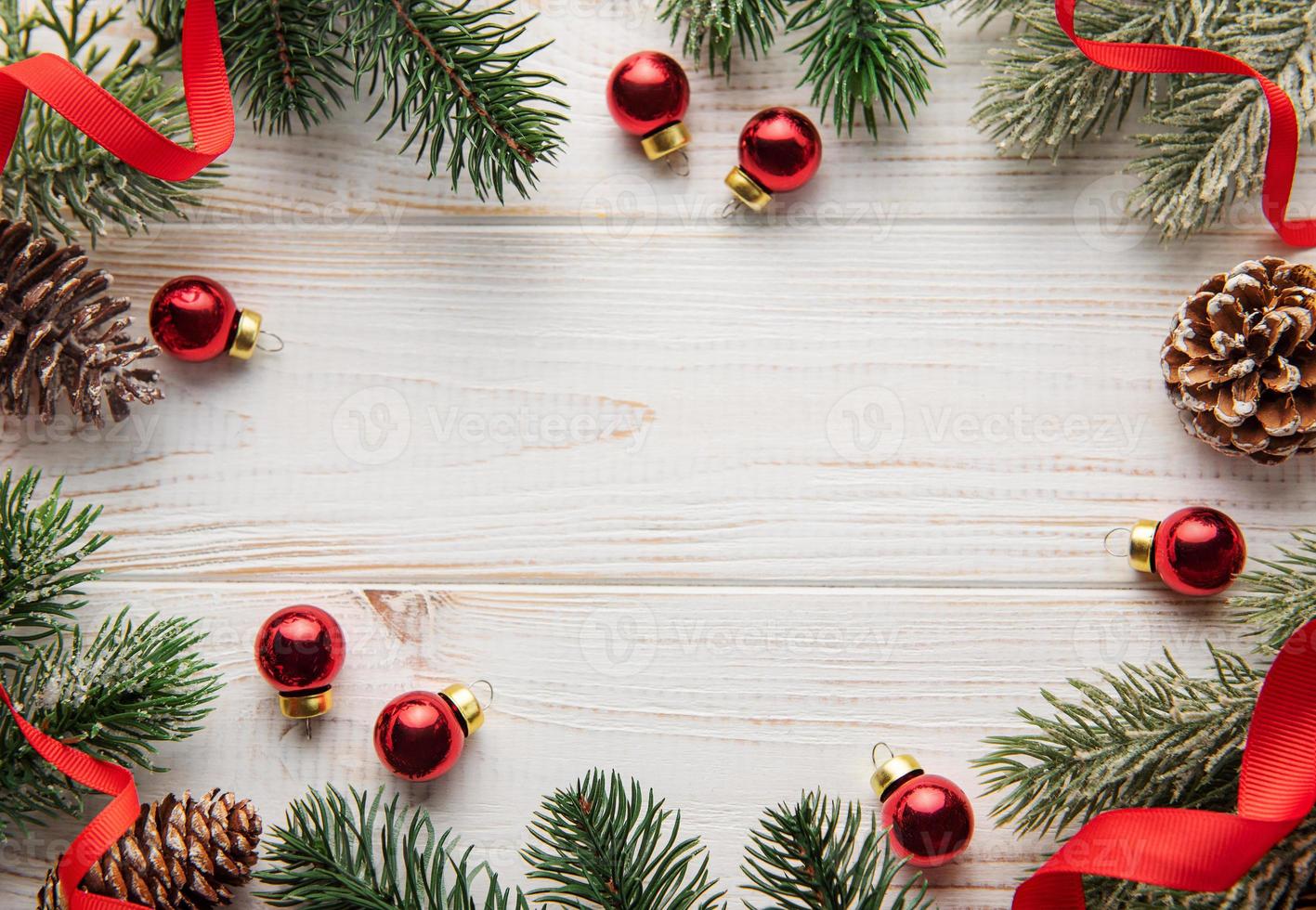 Christmas decoration with red ribbon making a frame with copy space. photo
