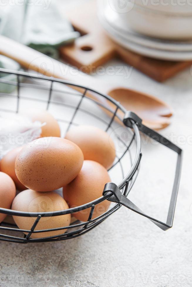 Basket of fresh brown eggs photo